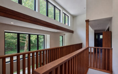 Open Atrium Connects Levels & Nature: A Frank Lloyd Wright-Inspired Whole-House Remodel